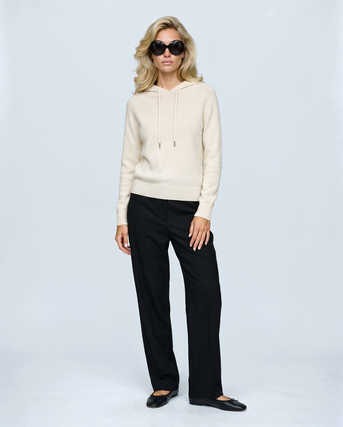 The Relaxed Knit Hoodie in Cream, front view on a non-pregnant model