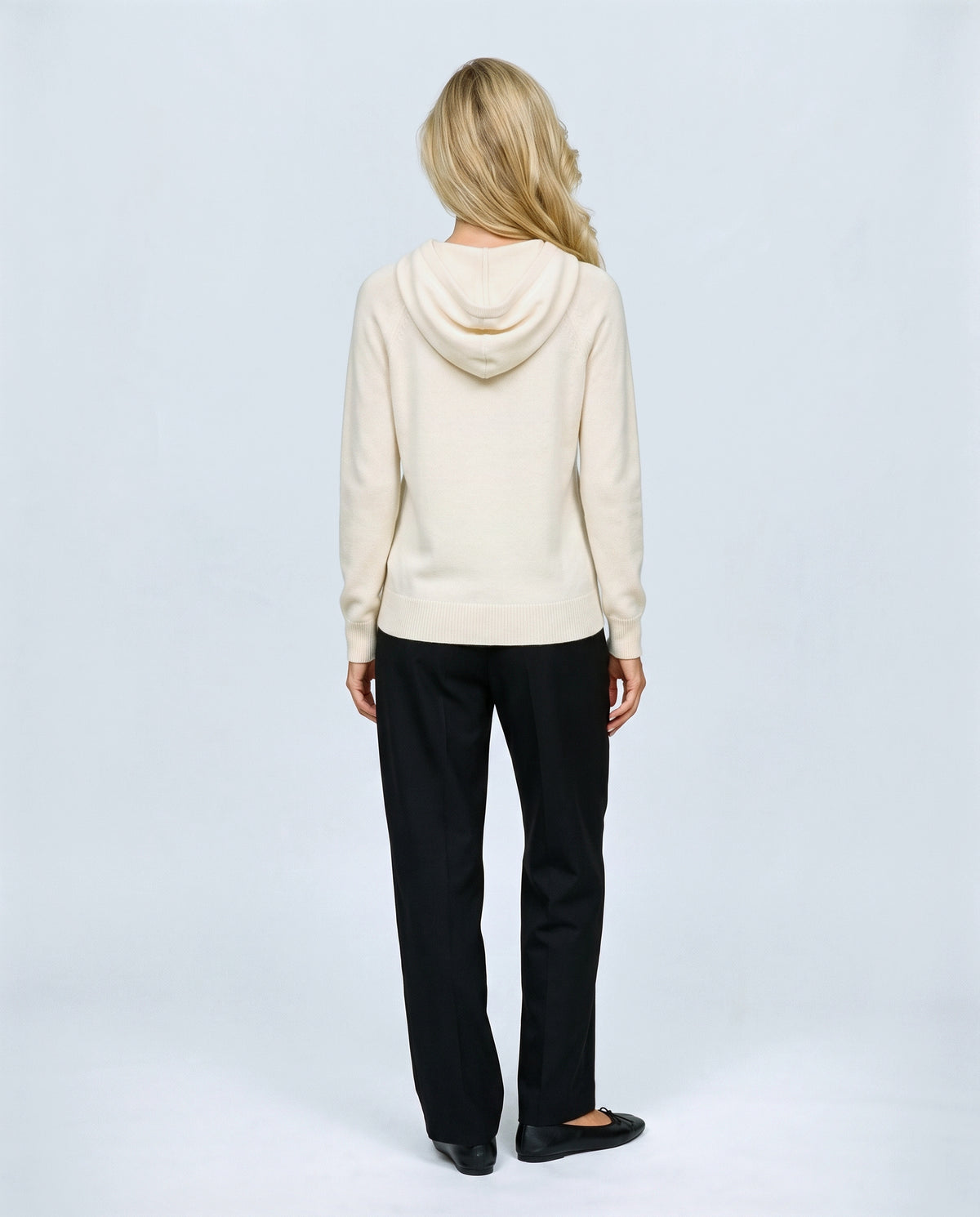 The Relaxed Knit Hoodie in Cream, back view on a non-pregnant model
