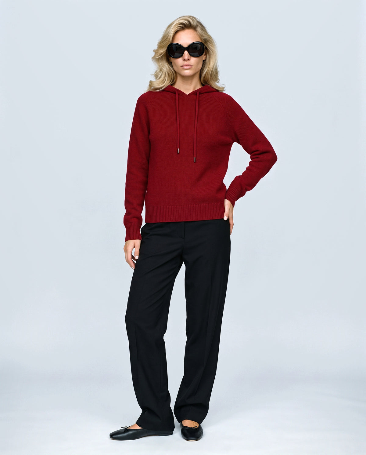 The Relaxed Knit Hoodie in Red, front view on a non-pregnant model