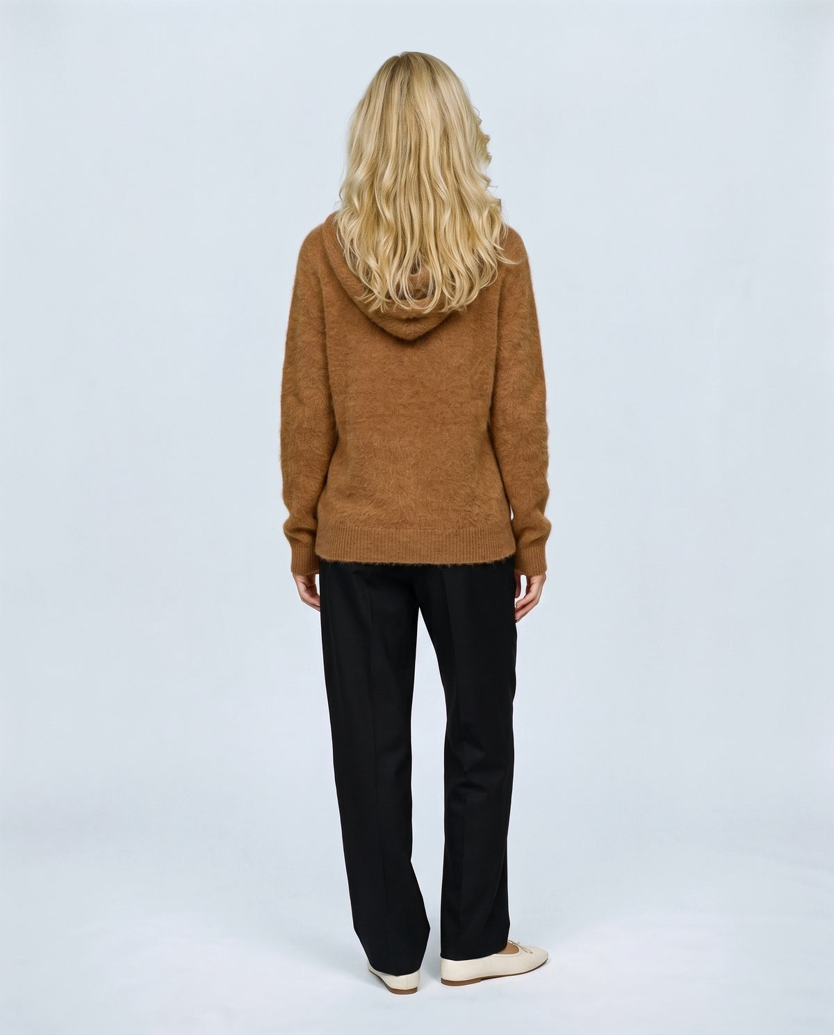 The Soft-Touch Knit Hoodie in Caramel, back view on a non-pregnant model