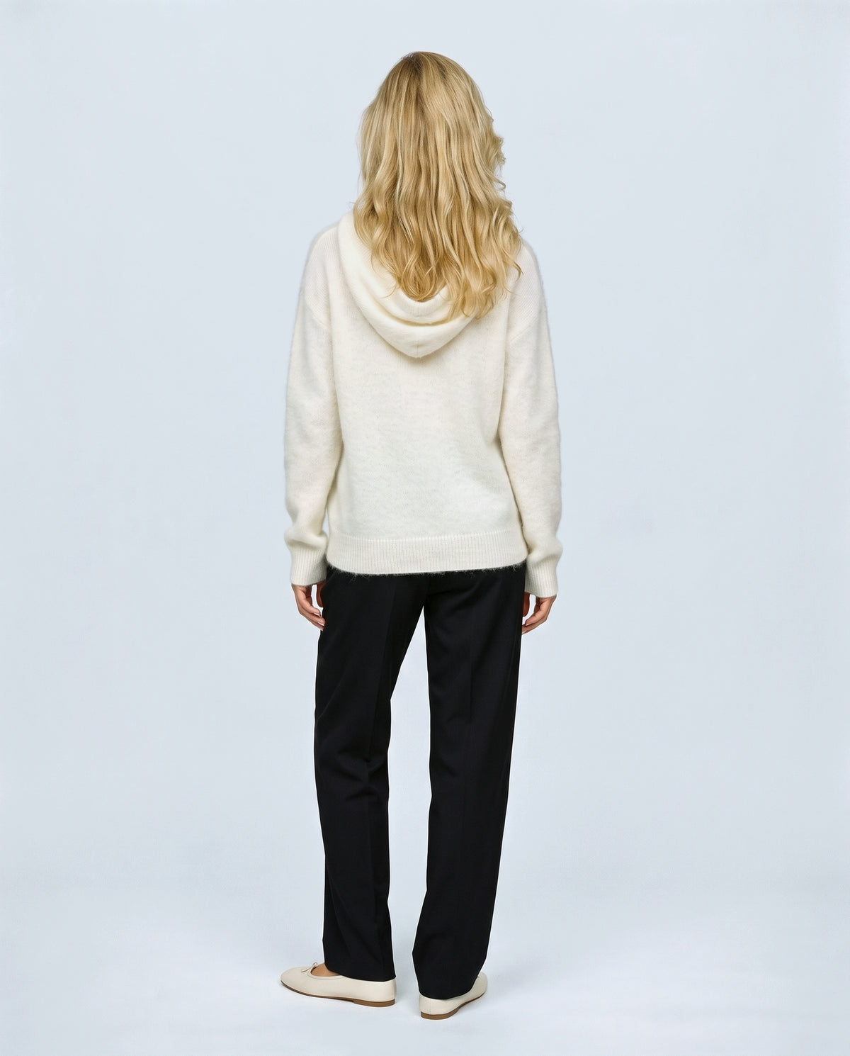 The Soft-Touch Knit Hoodie in Cream, back view on a non-pregnant model