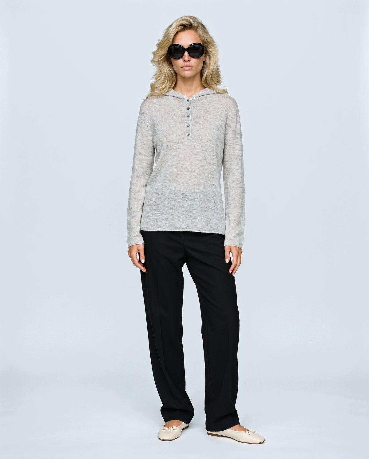 The Button-Neck Knit Hoodie in Grey, front view on a non-pregnant model