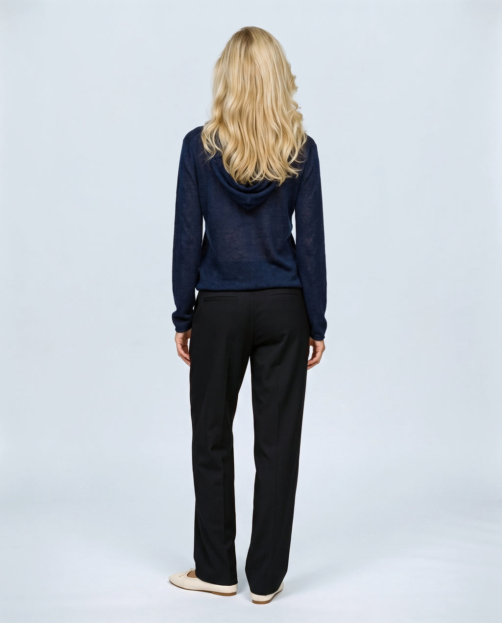 The Button-Neck Knit Hoodie in Navy, back view on a non-pregnant model