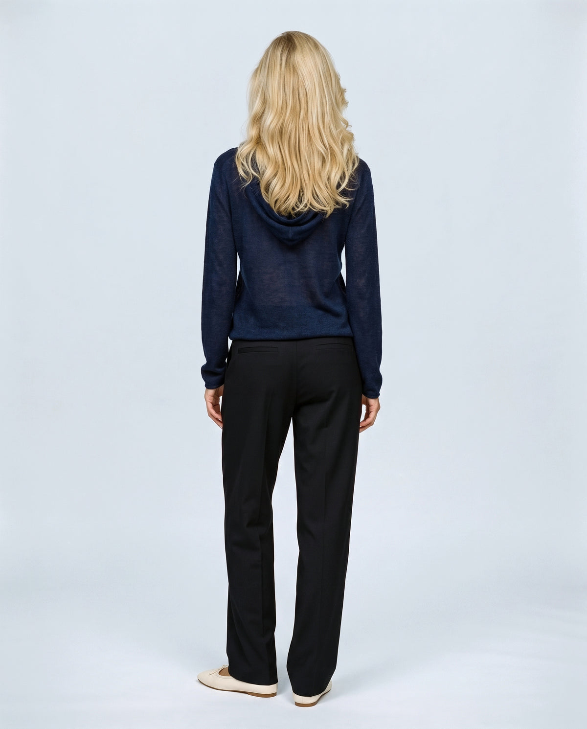 The Button-Neck Knit Hoodie in Navy, back view on a non-pregnant model