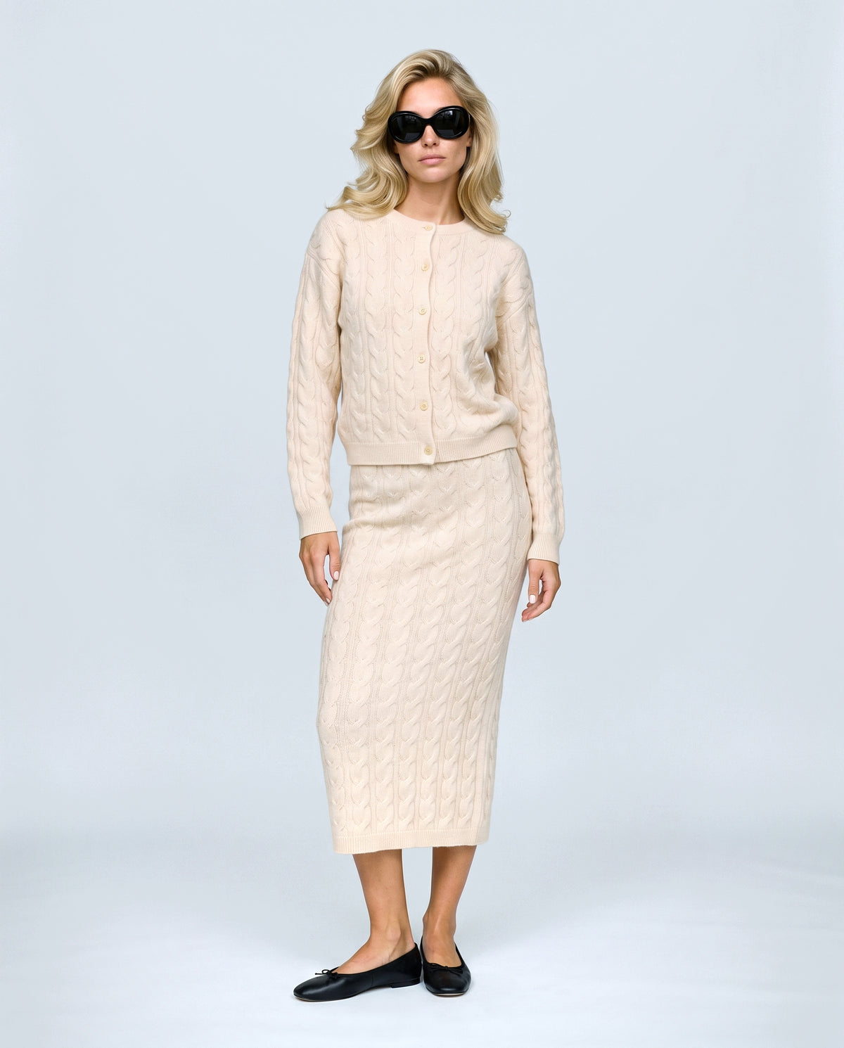 The Cable Knit Top & Skirt Set in Light apricot, front view on a non-pregnant model