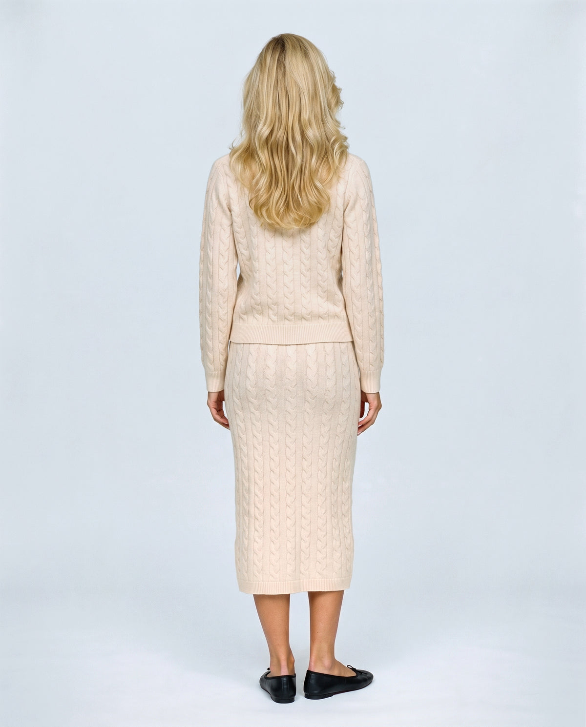 The Cable Knit Top & Skirt Set in Light apricot, back view on a non-pregnant model