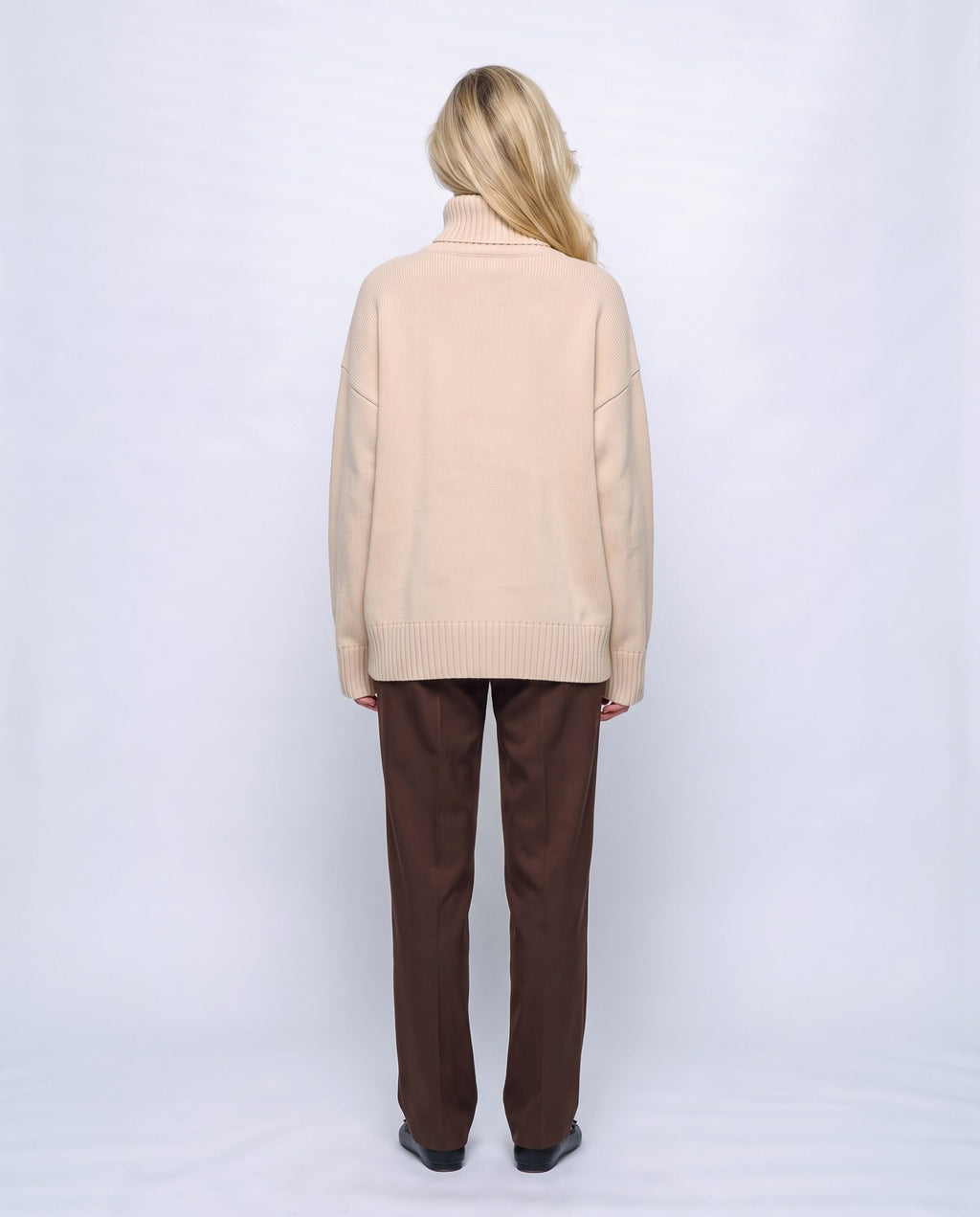 Nina Relaxed Turtleneck in Apricot, back view on a non-pregnant model