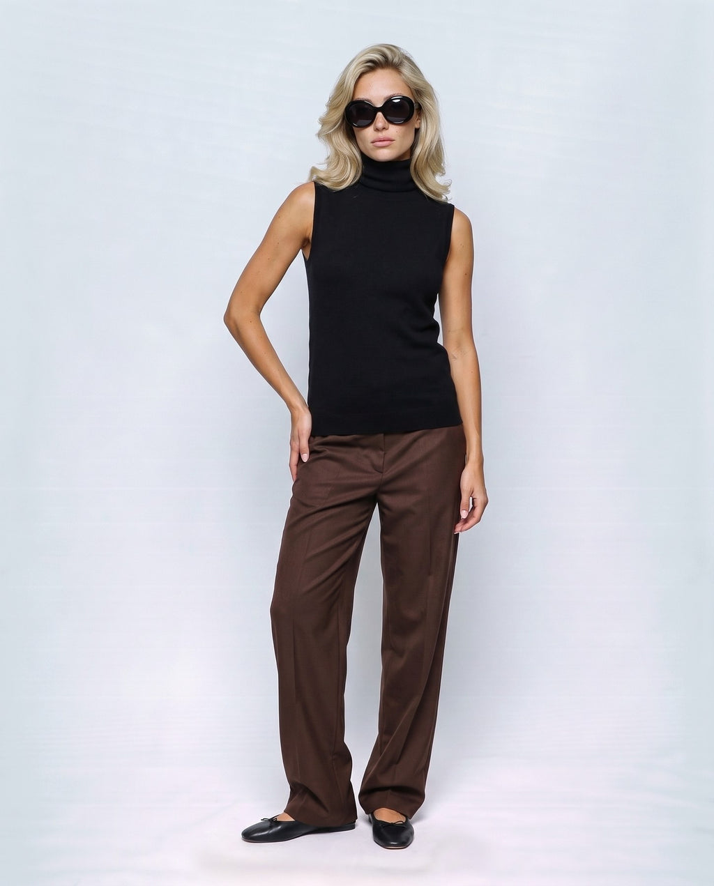 Noa Sleeveless Turtleneck in Black, front view on a non-pregnant model
