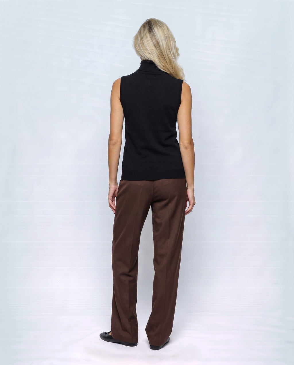 Noa Sleeveless Turtleneck in Black, back view on a non-pregnant model