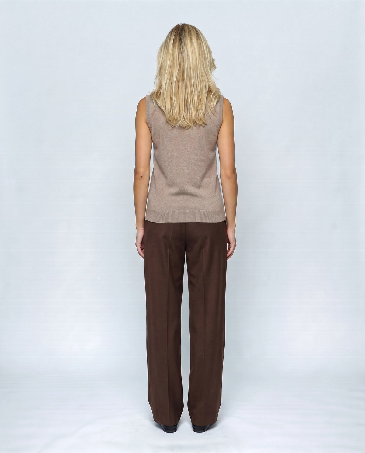 Noa Sleeveless Turtleneck in Camel taupe, back view on a non-pregnant model