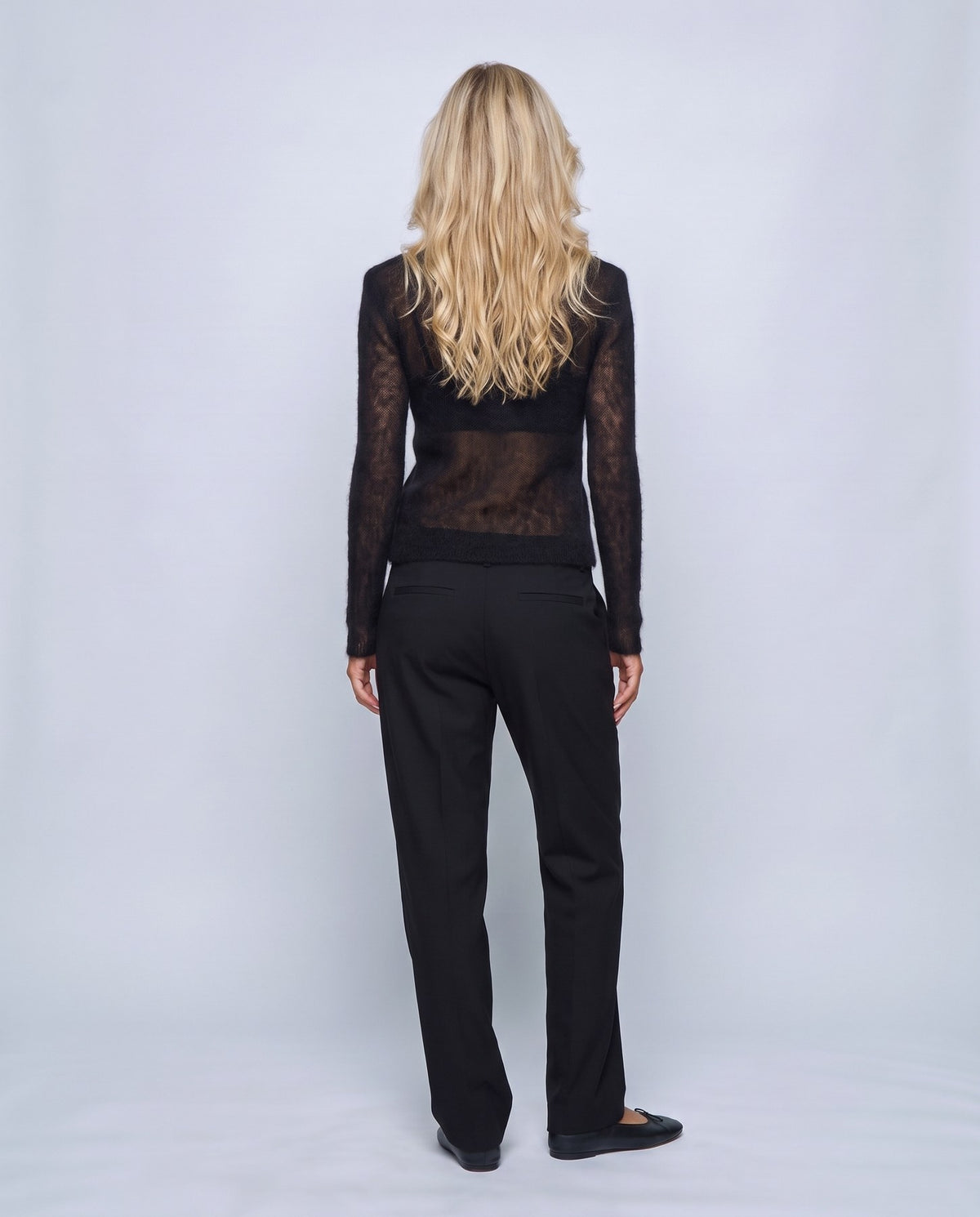 Odette Sheer Sweater in Black, back view on a non-pregnant model