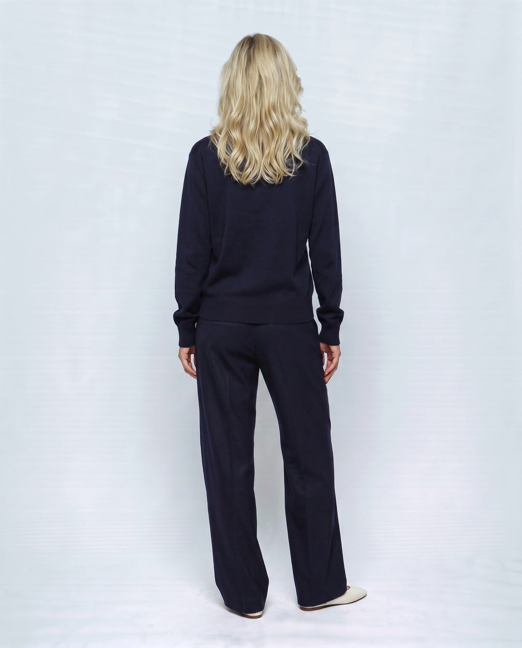 Romy Stand-Collar Cardigan in Navy, back view on a non-pregnant model