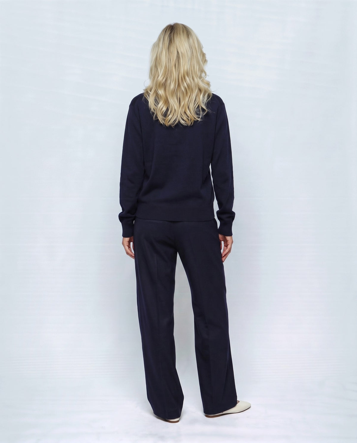 Romy Stand-Collar Cardigan in Navy, back view on a non-pregnant model