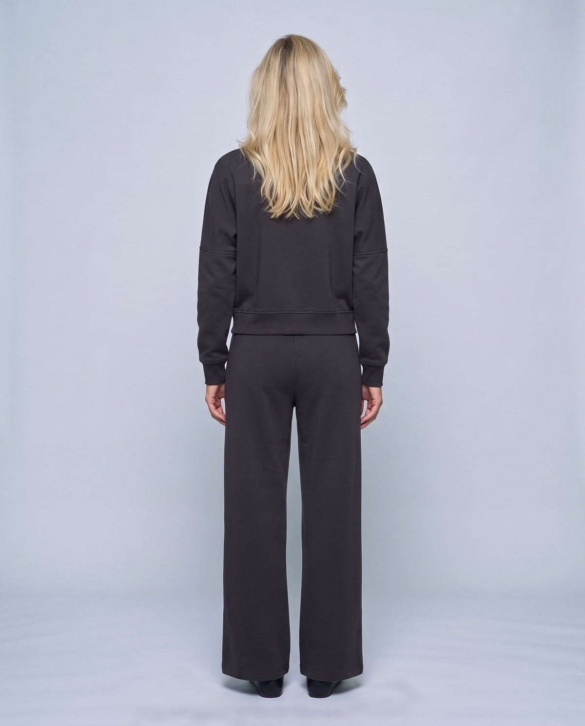 Sasha Zip Jacket & Pant Set in Black, back view on a non-pregnant model